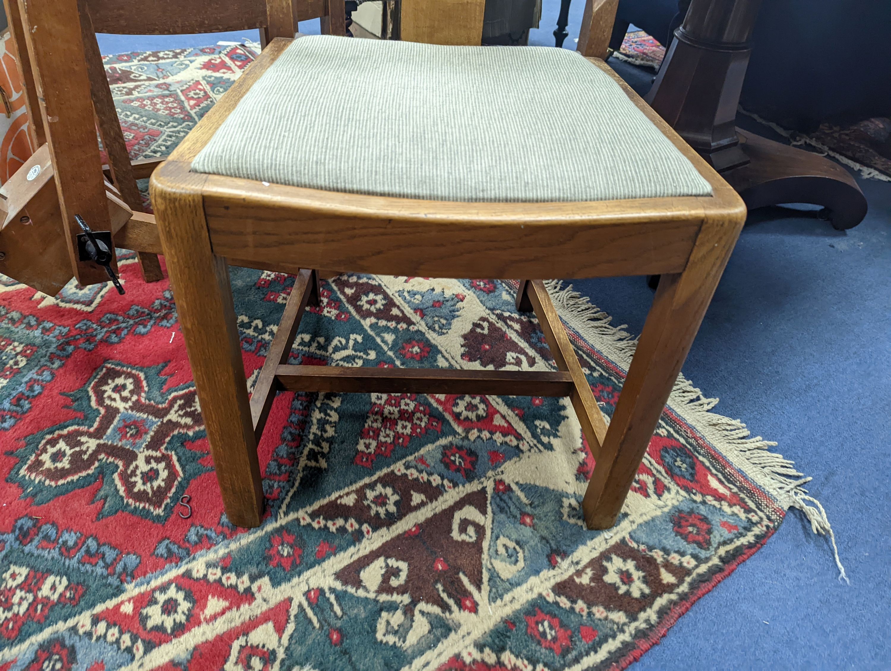 A pair of Arts and Crafts oak side chairs, outer Hebrides